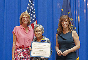 Photo of Martha Byler receiving the award