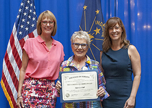 Photo of Maureen Hall receiving the award