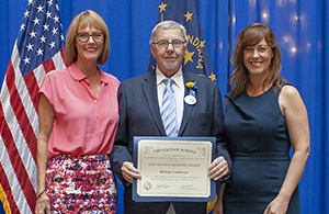 Photo of Richard Aeschleman receiving the award