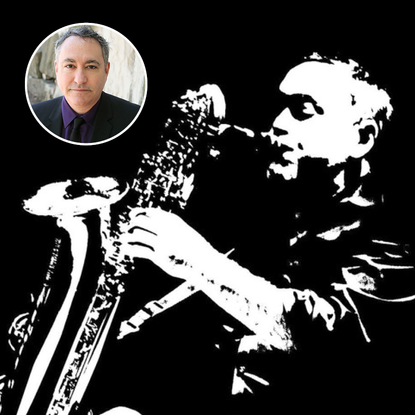 Man with salt and pepper hair; man playing sax