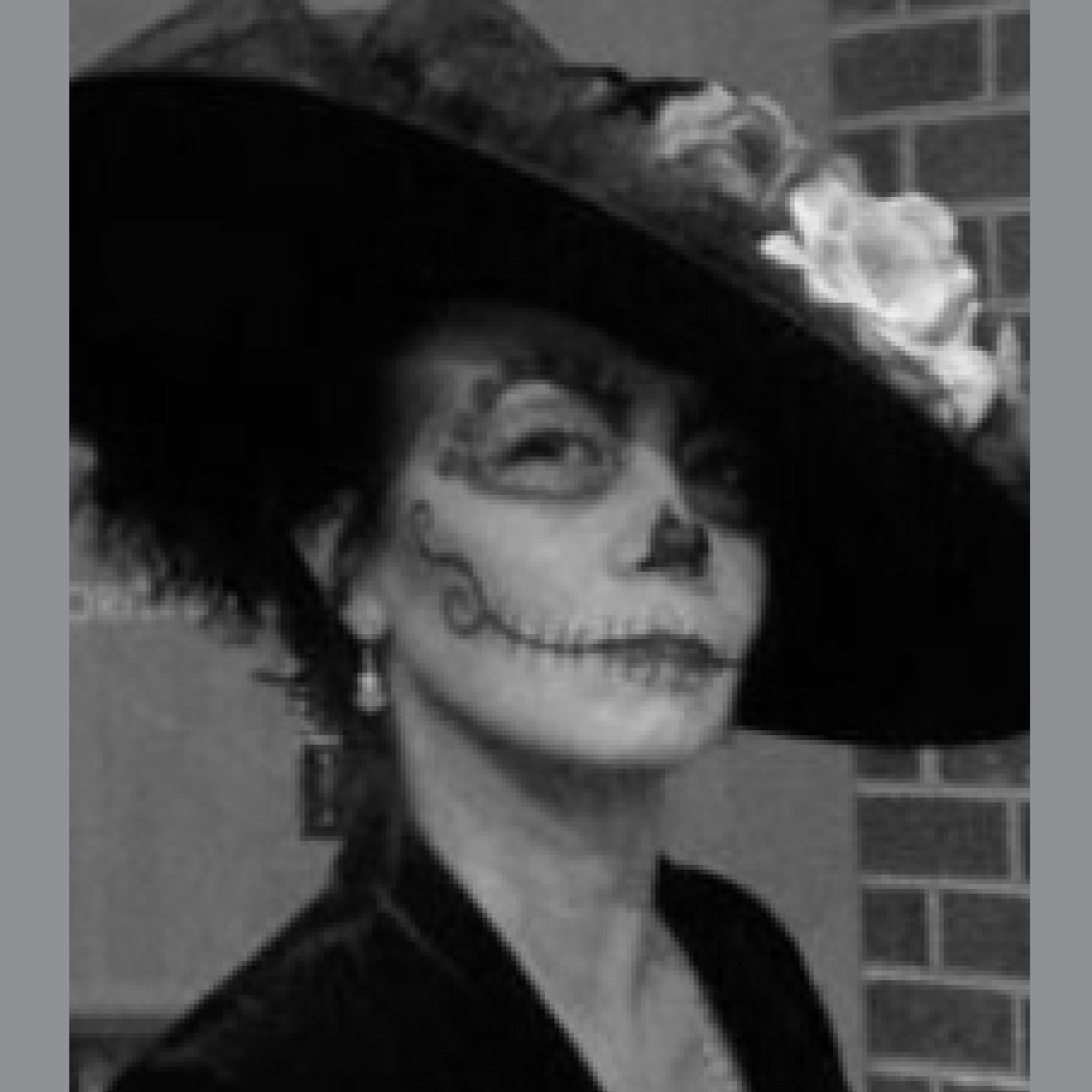 Photo of woman with hat and face makeup