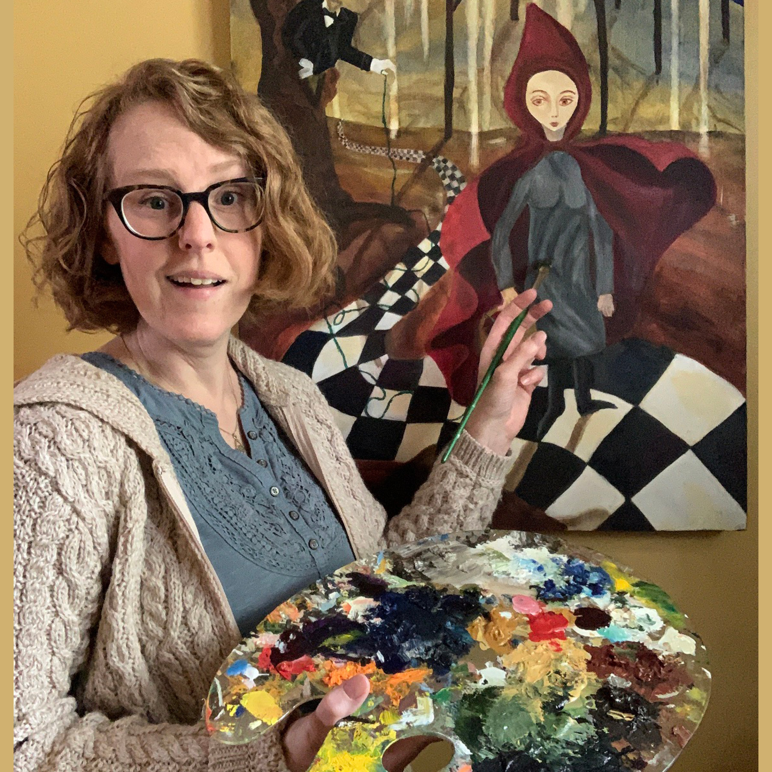Person standing with a paint palette next to a painting 