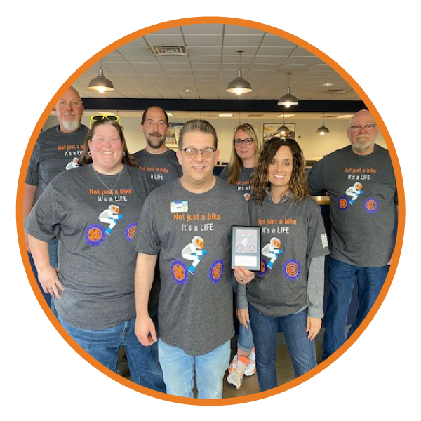 Mike Chriswell from Muncie branch wearing his winning RSI shirt design with the RSI team members