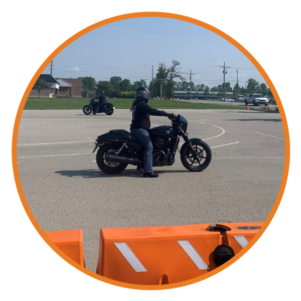 Women riders riding bikes through the safety course