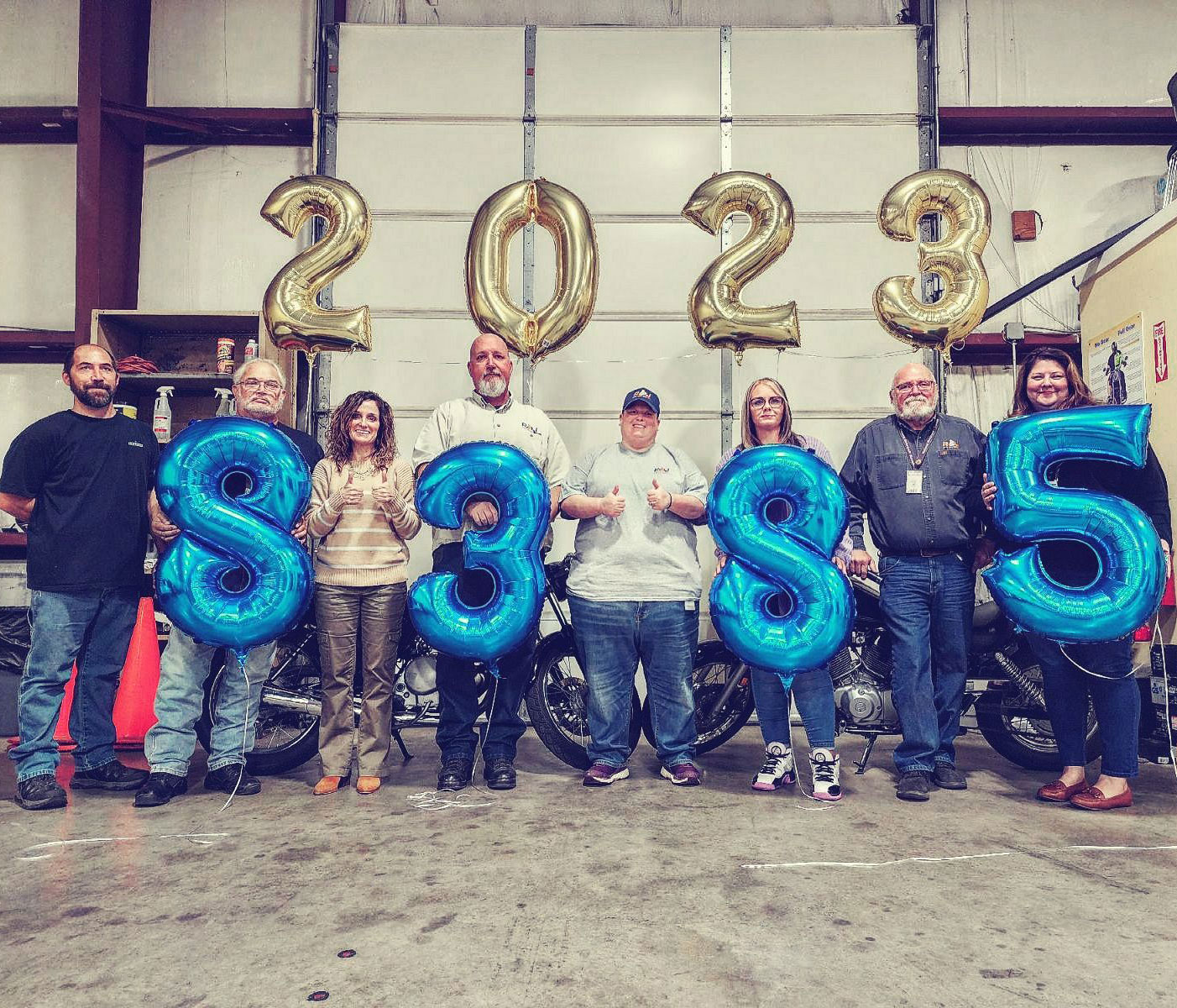 The RSI team holding balloons, celebrating 8,385 Hoosier trained in their courses in 2023.