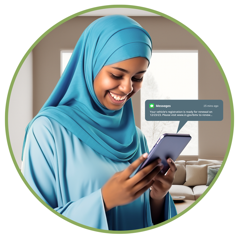 woman of color in a hijab reviewing a text message notice on her phone