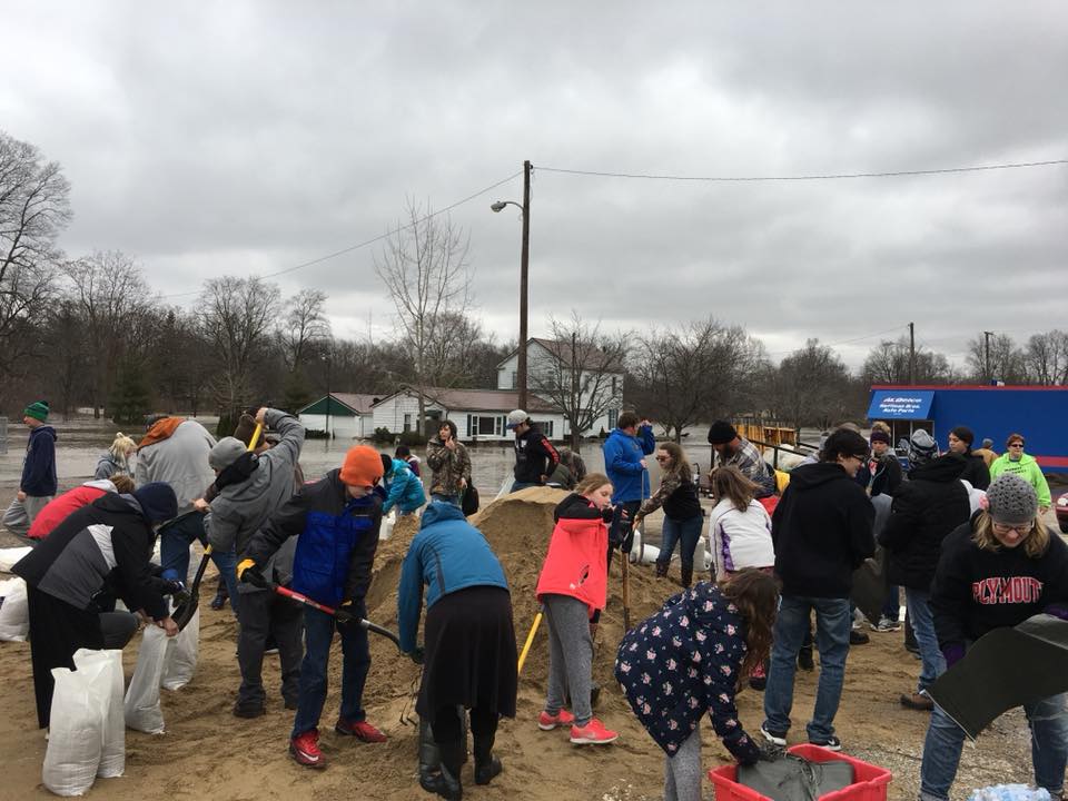 Volunteers Help Fill Sandbags During Flood