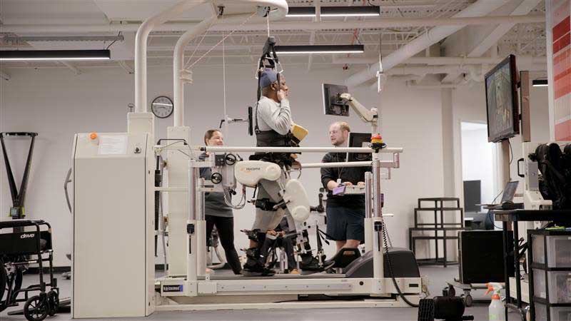 Person using medical equipment to walk