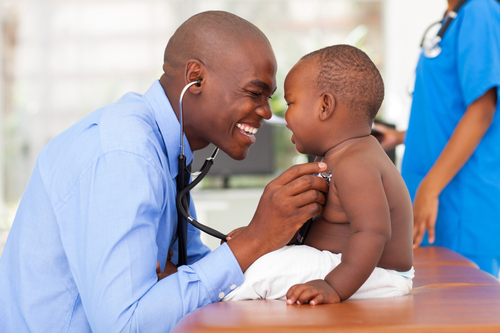 doctor using stethoscope on baby doctor using stethoscope on baby
