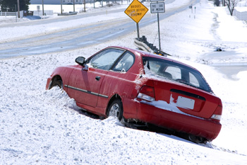 Car in snow on the side of road