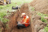a man completing an archaeological or historical investigation.