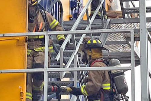 Firefighters climb stairs at Linton training facility