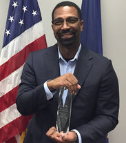 DWD Commissioner Fred Payne Holding HIRE Program Award