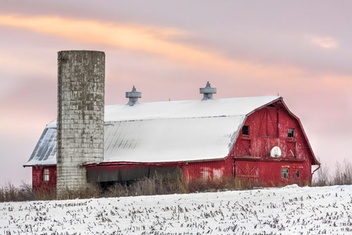 Snow on field and red barn Snow on field and red barn