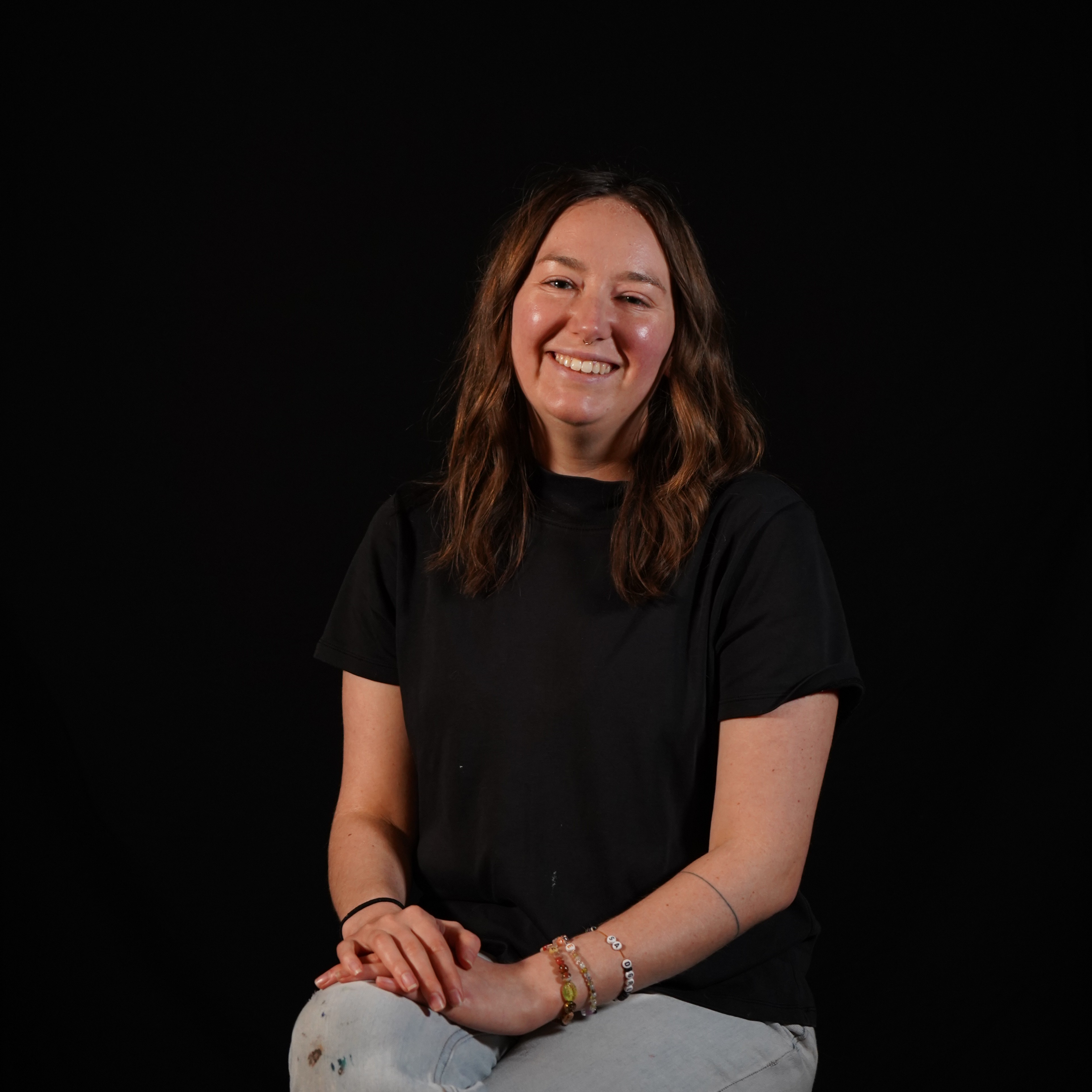 Woman sitting on stool 