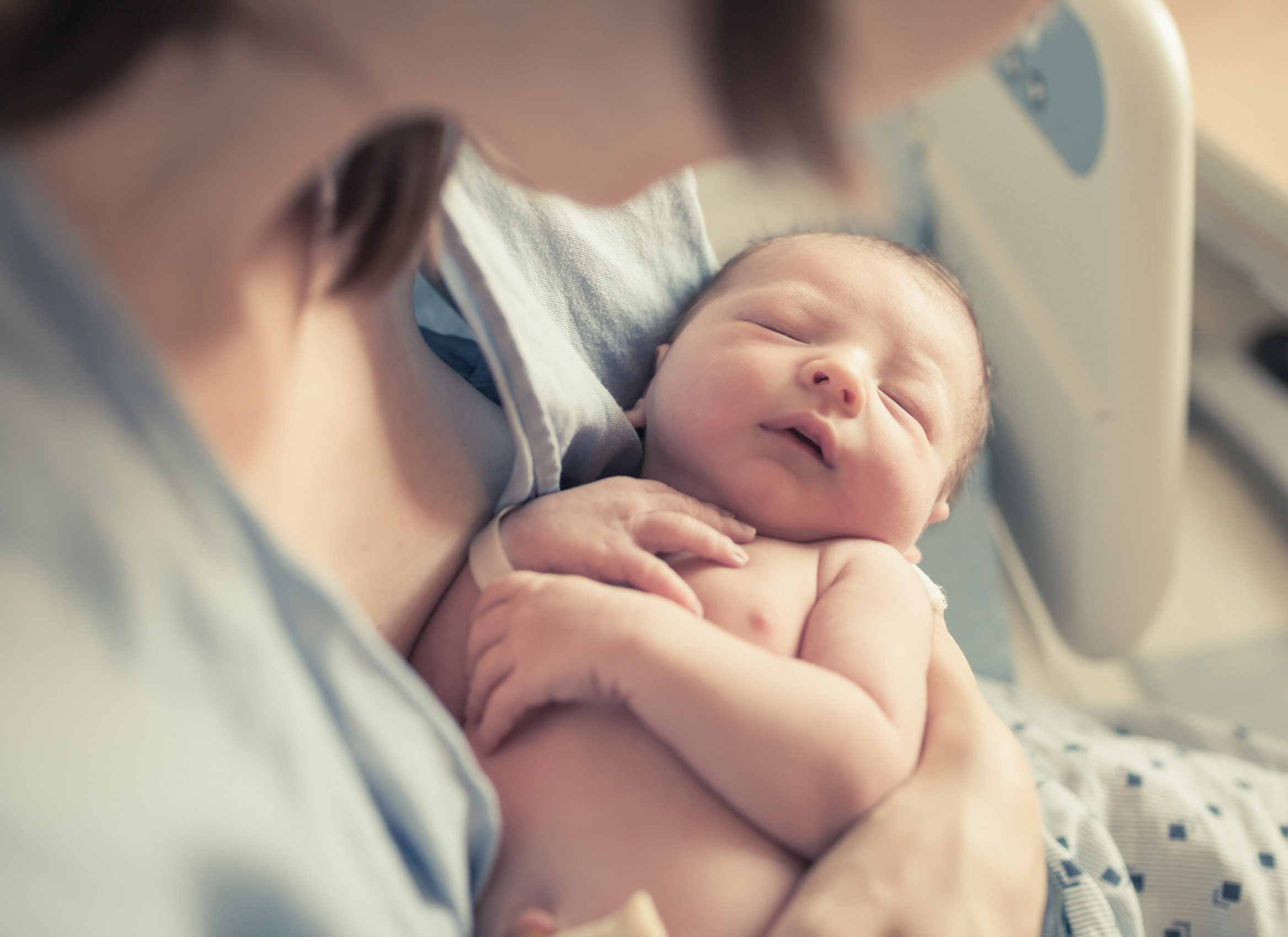 mom holding newborn baby