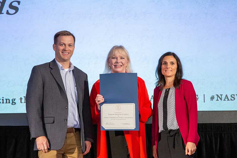 Picture of DWD staff accepting award for Unemployment Insurance Integrity award