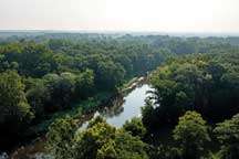 Morning haze rises above the Tippecanoe River as it flows beside the park near Winamac that bears its name. Seven miles of the river flow along the park’s eastern boundary. Photo by Brent Drinkut.