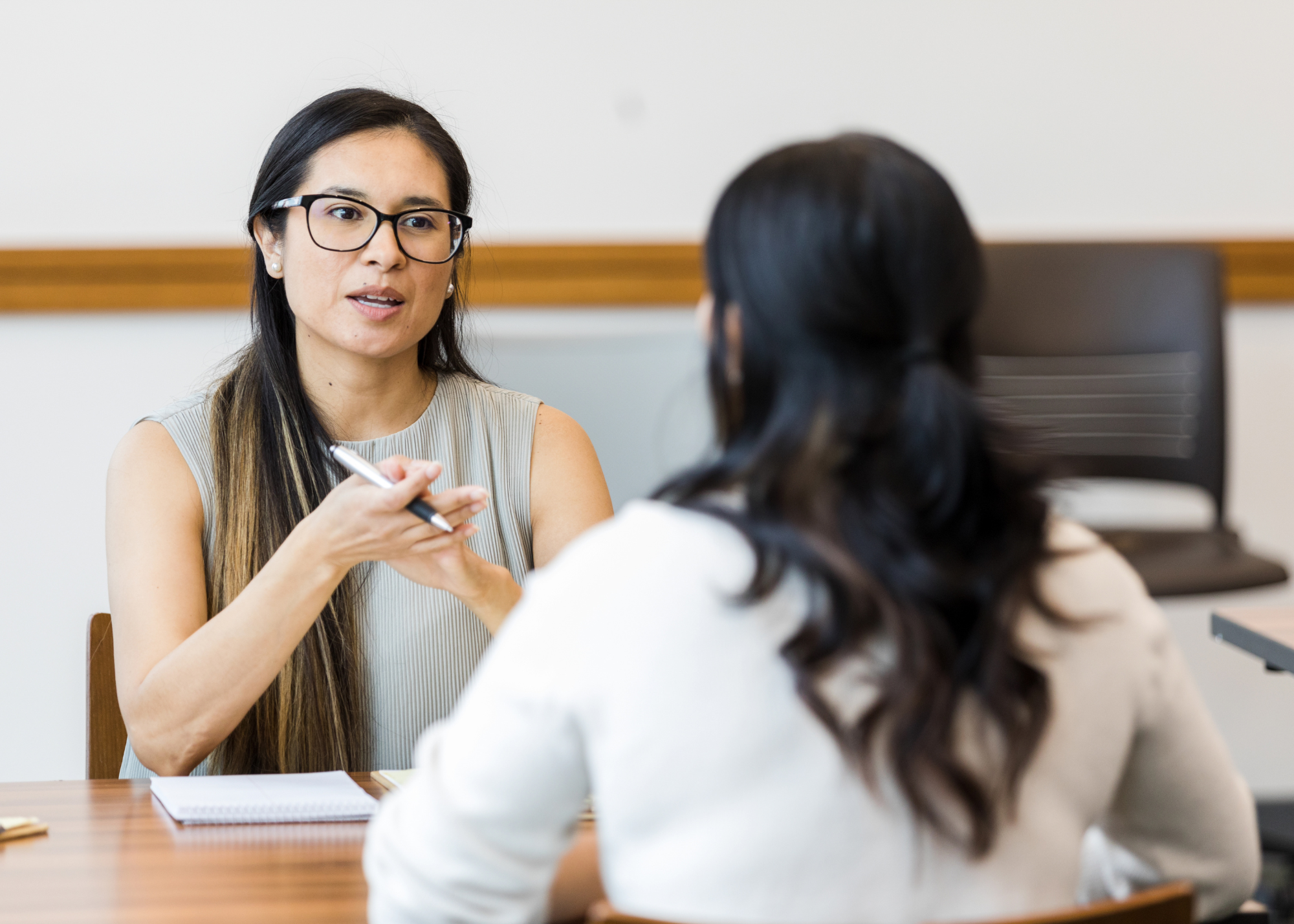Two people meeting at desk