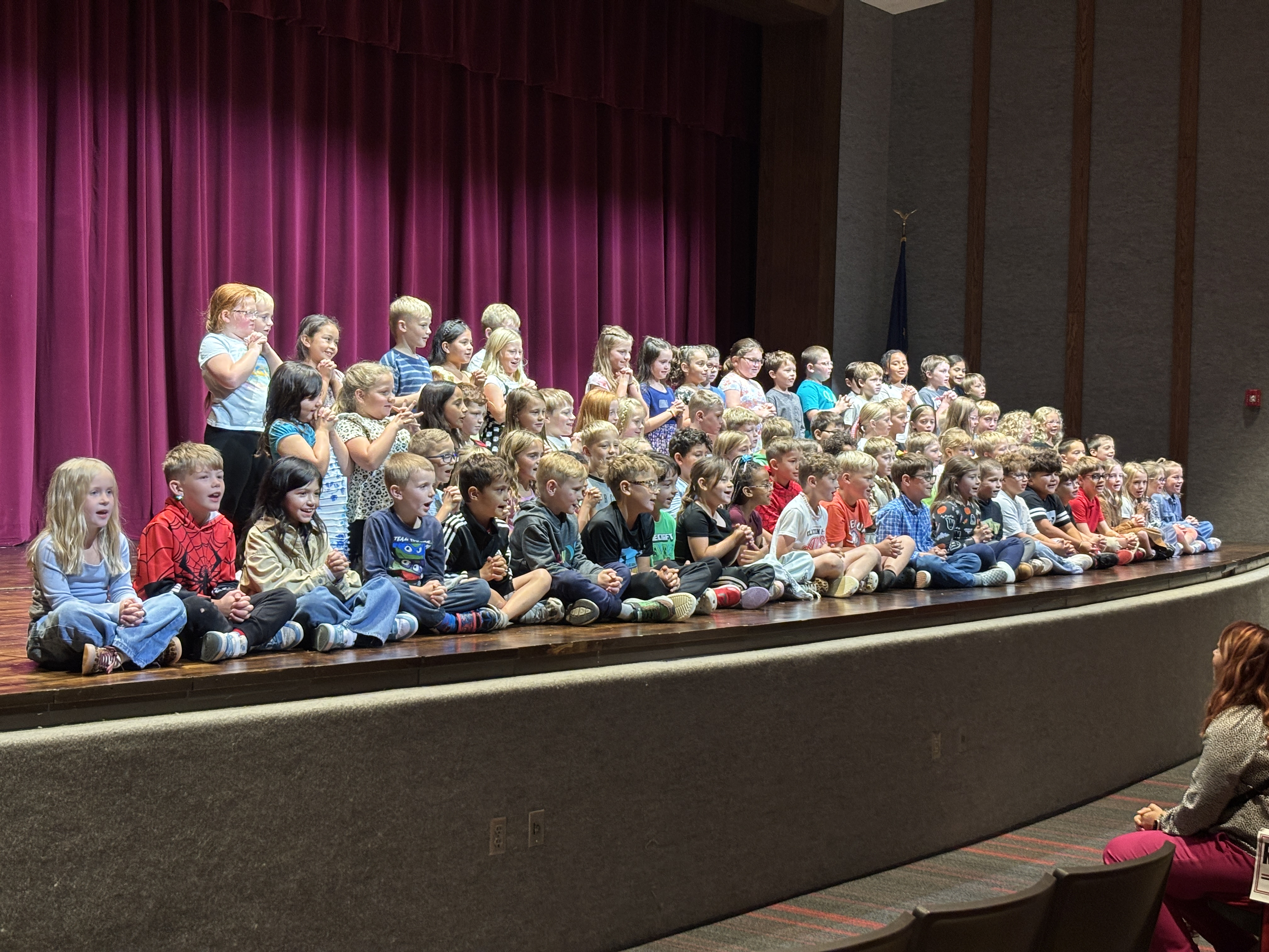 Students take the stage to perform for their grandparents.