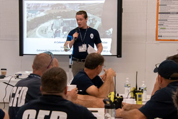 Man speaking to room of people