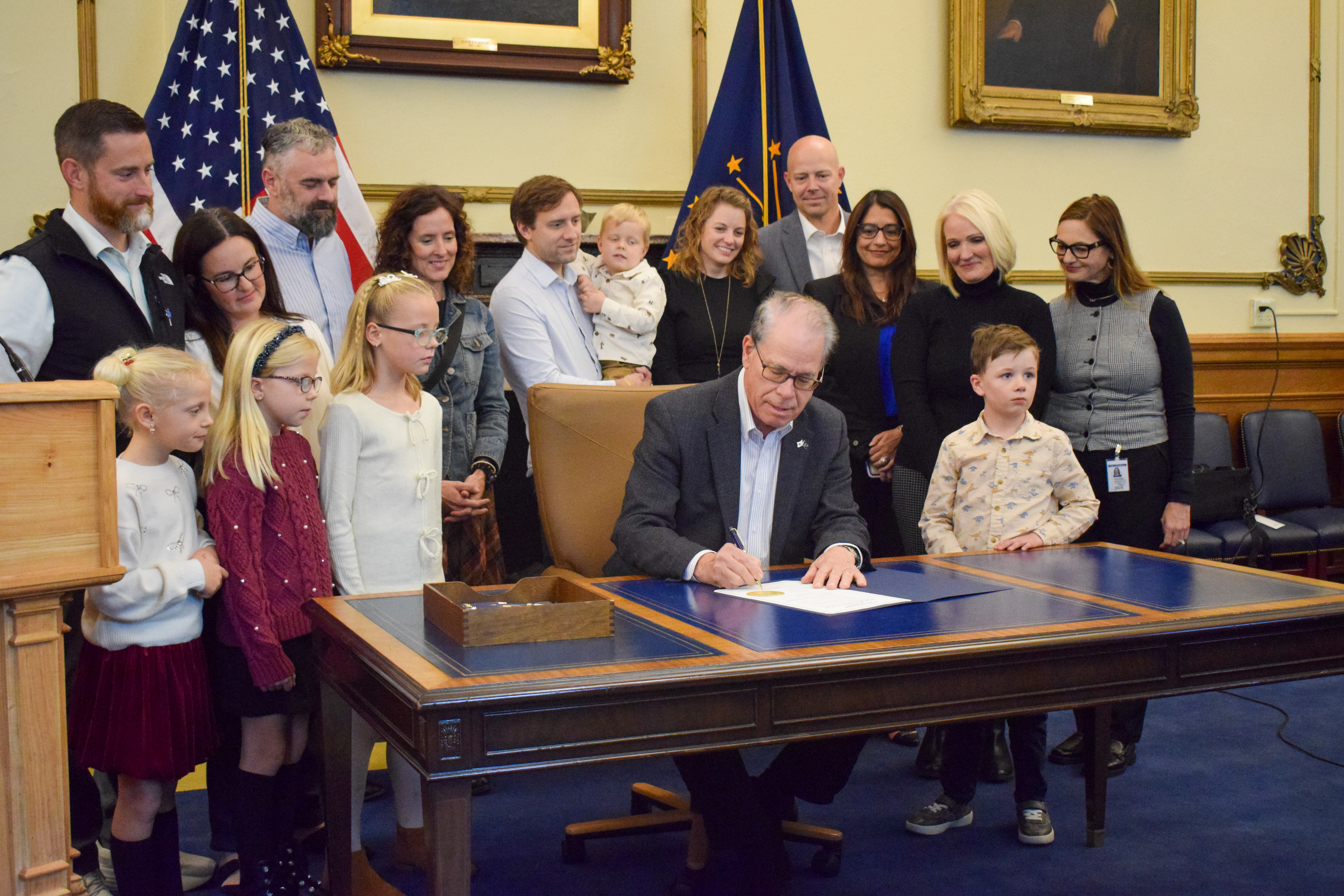 Gov. Braun signing the proclamation for Adoption Month.
