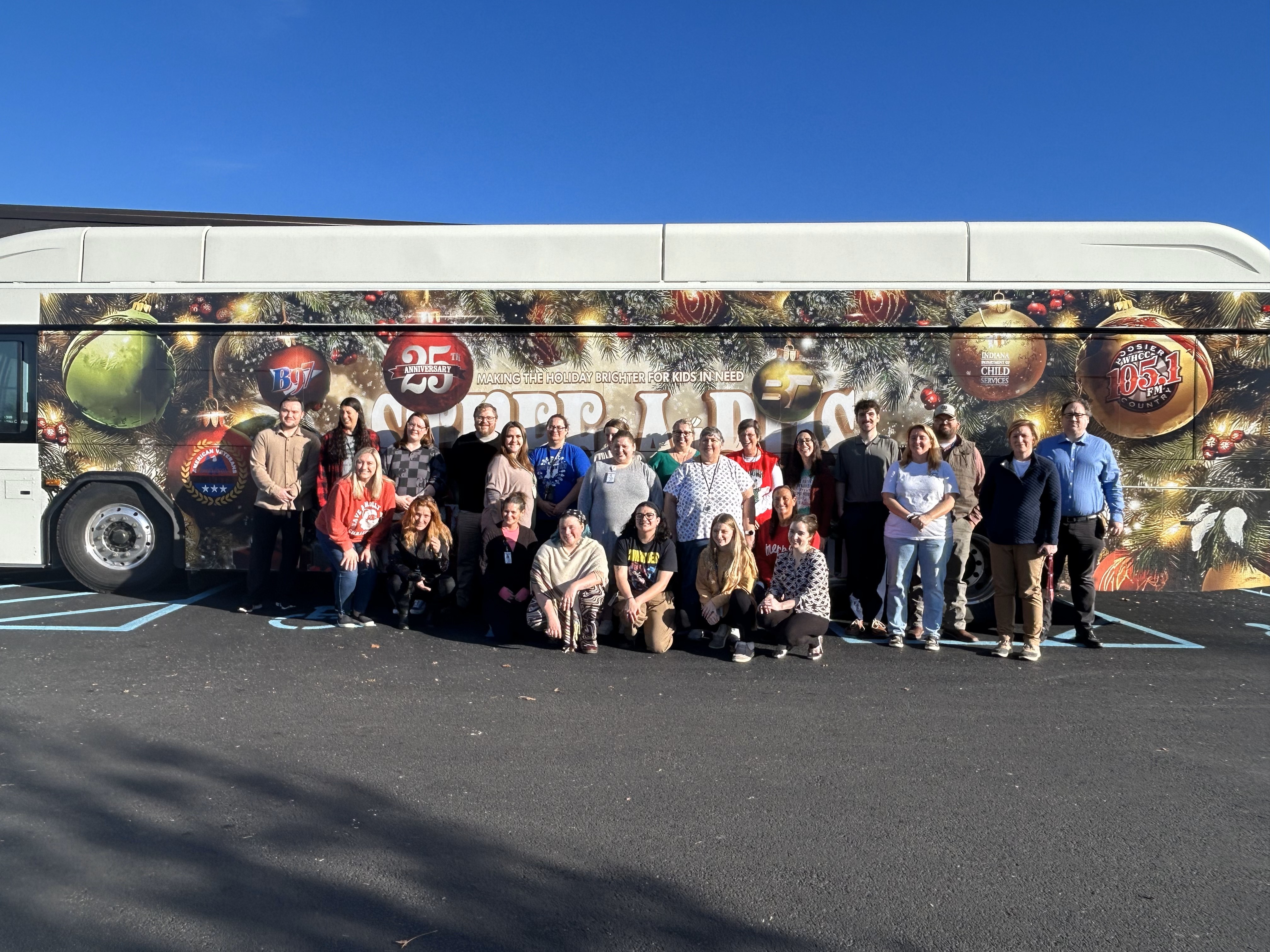 Monroe County DCS staff in front of the bus