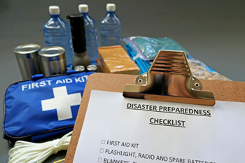 Clipboard with checklist and kit items in background