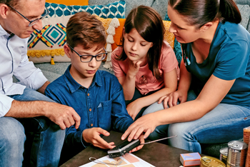 Family listening to emergency radio