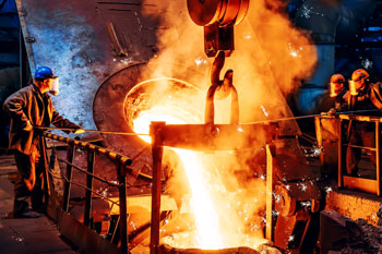 Metal workers in foundry