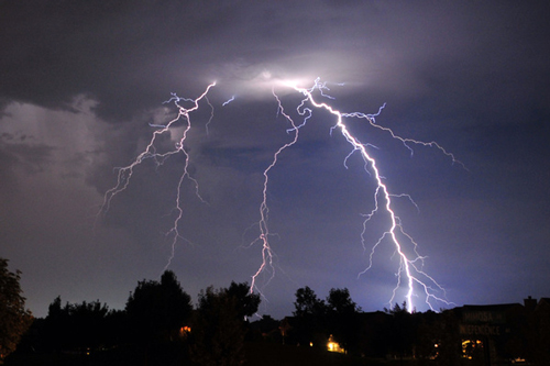 Lightning bolts over residential area in Marion County