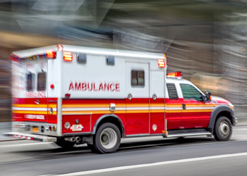 Ambulance moving fast with blurred background