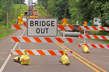 Sign that says "Bridge Out" at construction site