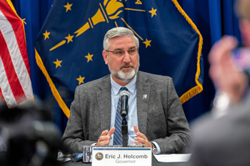 Eric Holcomb at table