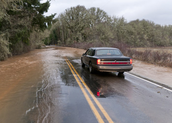 Car stopped before floodwaters cover road