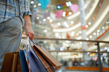 Holiday shopper with bags in mall