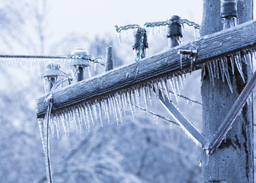 Ice covering power lines and pole