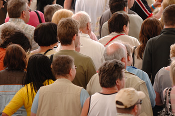 Crowd of people walking in same direction