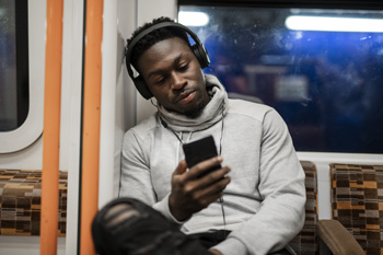 Man on phone on train