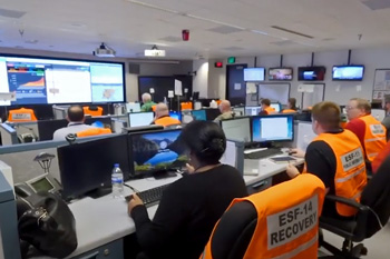 Workers in state EOC room