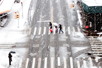 City street with flurries swirling around the focal point creating a beautiful snowy scene