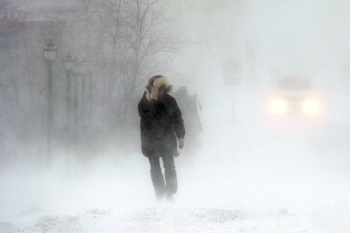 Person walking in winter storm
