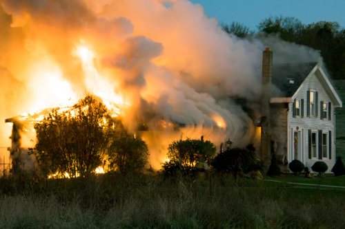 House on fire with smoke billowing out