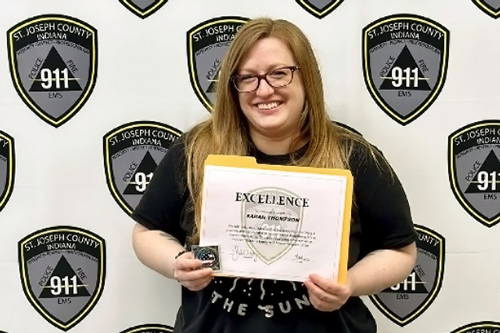 St. Joseph County telecommunicator poses with certificate