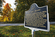 An information placard provides details of the lake’s historical significance.