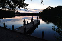 
  Children fish at Lake Lincoln while staying with their parents at Lincoln State Park’s family cabins. Young Abraham Lincoln lived for 14 years among the area’s woods and waters. (John Maxwell photo)
