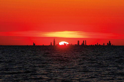 William Power La Porte William took this photo of Chicago from above Central Avenue Beach at Indiana Dunes National Park in late April last year. He said the alignment of the sun and skyline takes place twice each year, then and in mid-August, and he makes sure to visit the park during those times. 