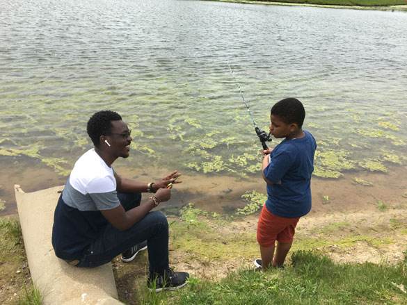 Adult and child fishing