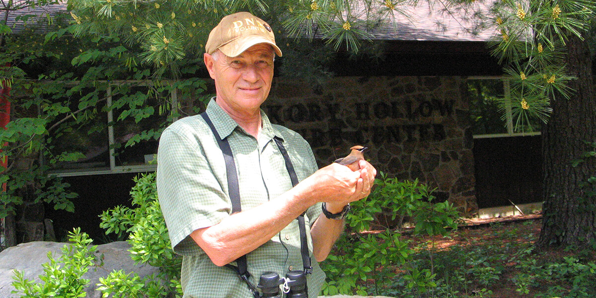 man holding bird