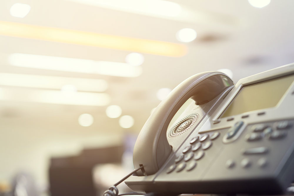 Image of a desk phone in focus